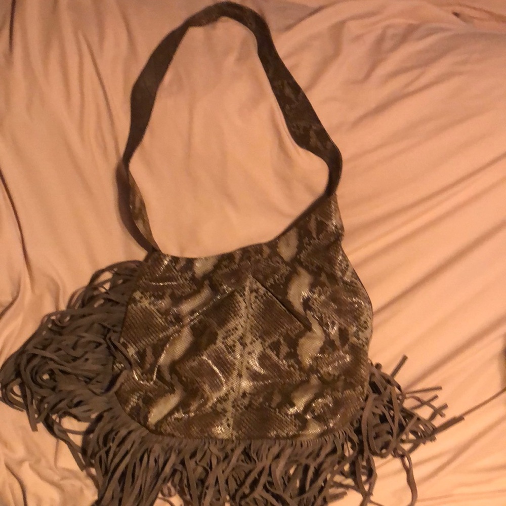 Camila Alves snakeskin purse with fringe